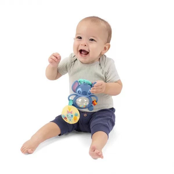 BRIGHT STARTS Hračka na C kroužku senzorická Stitch Tummy Tumble™ 0m+