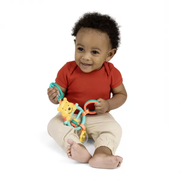 BRIGHT STARTS Hračka na C kroužku aktivní Winnie the Pooh Busy Bear™ 0m+