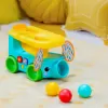 BRIGHT STARTS Autíčko vkládací s míčky Pop & Roll Safari Bus™ 6m+