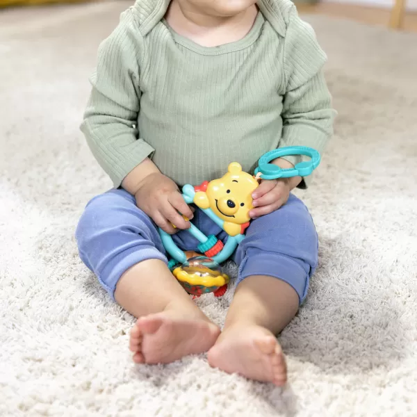 BRIGHT STARTS Hračka na C kroužku aktivní Winnie the Pooh Busy Bear™ 0m+