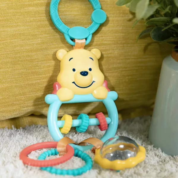 BRIGHT STARTS Hračka na C kroužku aktivní Winnie the Pooh Busy Bear™ 0m+