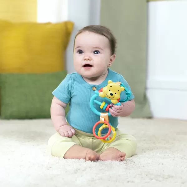 BRIGHT STARTS Hračka na C kroužku aktivní Winnie the Pooh Busy Bear™ 0m+