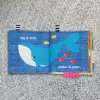 BABY EINSTEIN Měkká kniha plná aktivit Ocean Opposites™, 0m+
