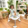 INGENUITY Hračka aktivní skákací se stolkem 2v1 Bounce to Bloom™ Chambray