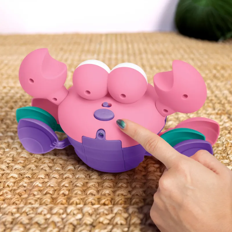 BRIGHT STARTS Hračka hudební a multisenzorická Rockin' Crawling Crab™ - 6m+